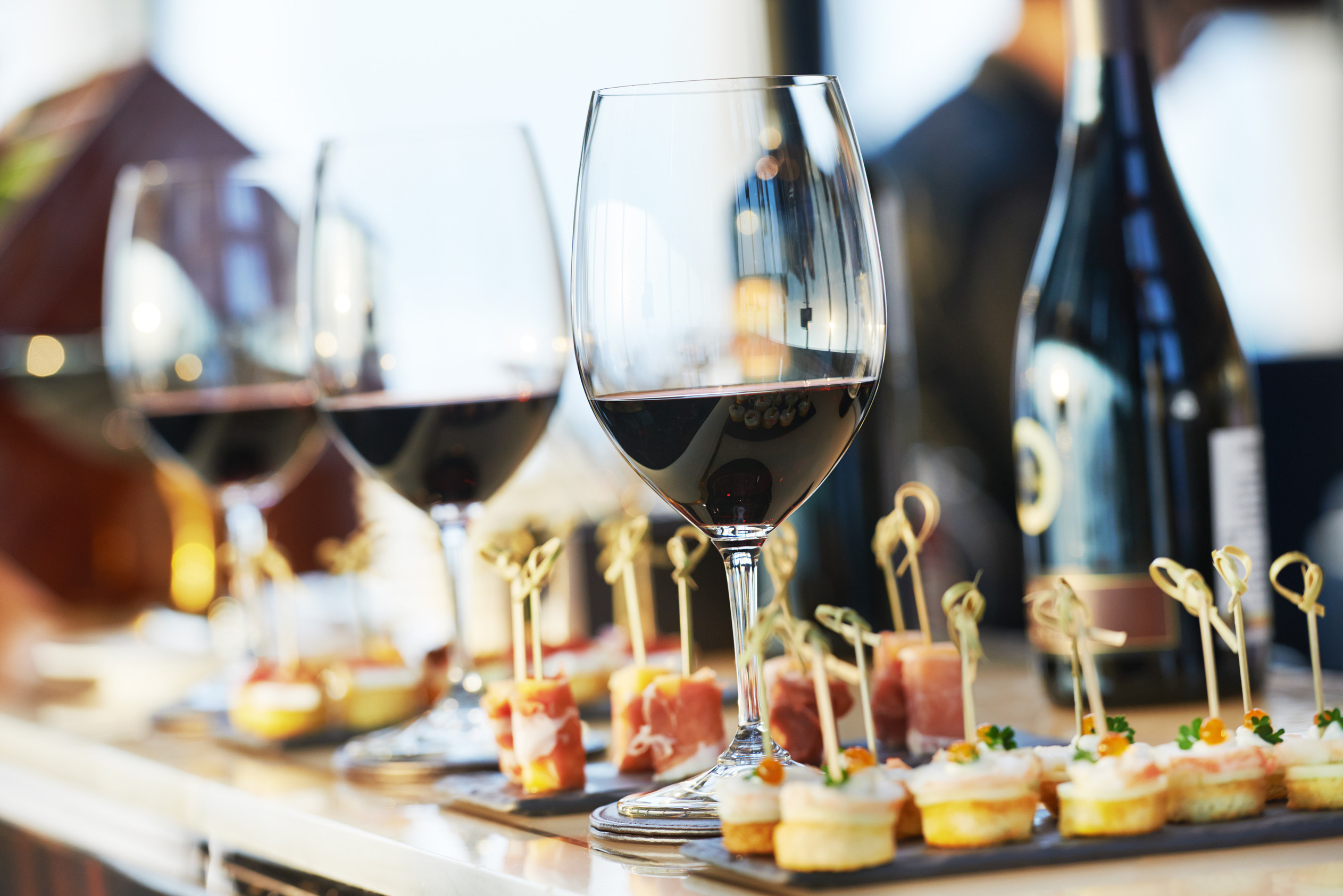 catering services background with snacks and glasses of wine on
