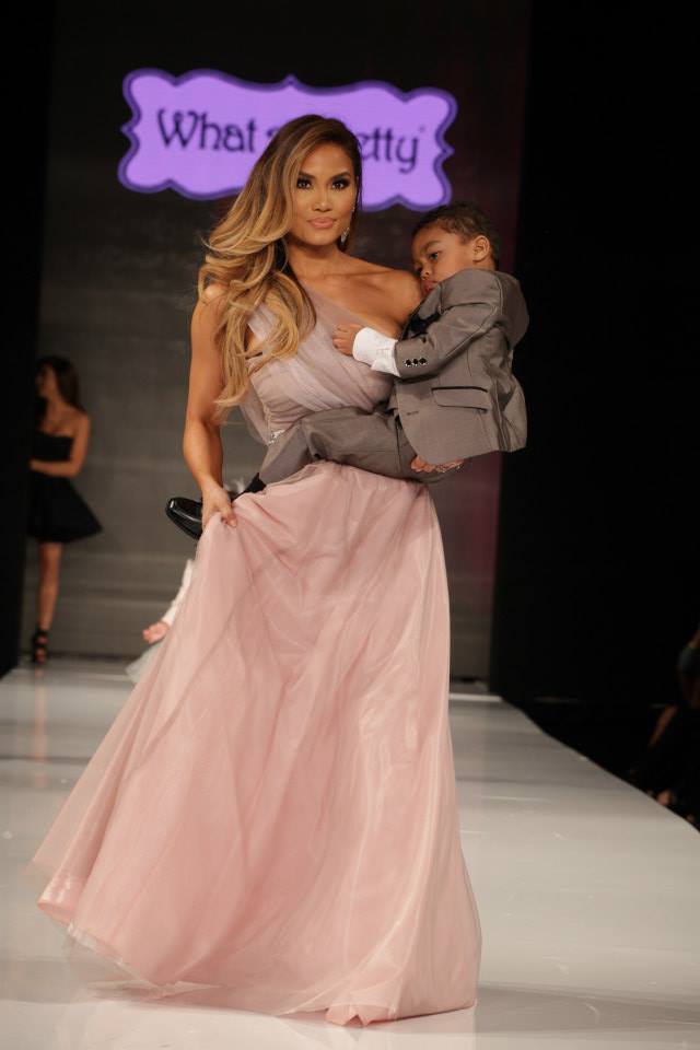 Daphne Joy Carries 50 Cent's Son Sire Down the Runway at Taglyan (Photo By Jeff Linett)