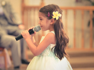 Little Girl Holding Microphone